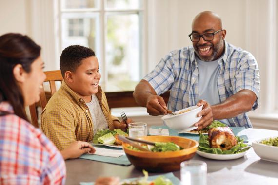 YMCA Healthy Living Eating Salad With Family