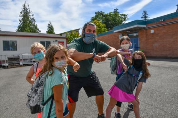 YMCA Youth Sports Volunteer Safely Congratulating Kids