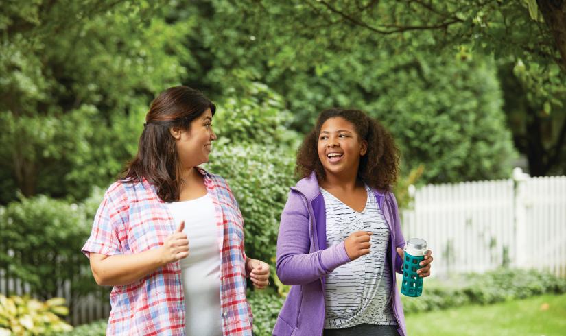 Mother and Daughter Walking Together With YMCA Weight Loss Program