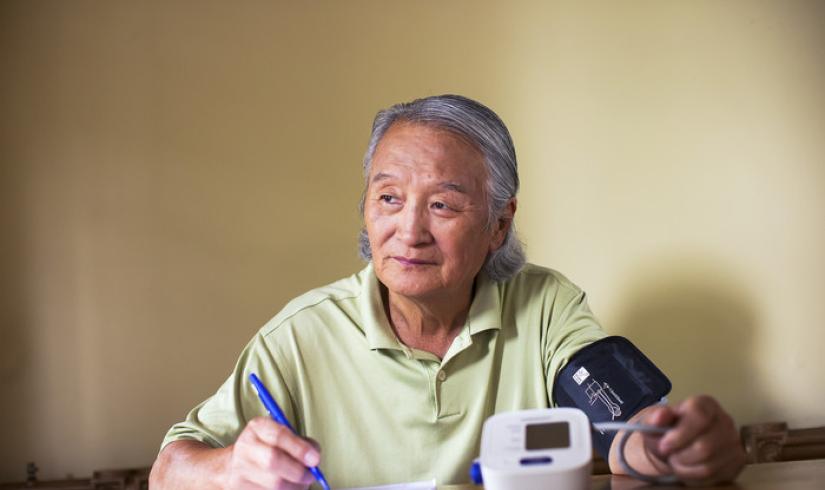 Active older adult self-monitoring their blood pressure
