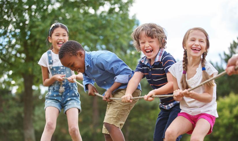 Kids Playing Tug Of War At YMCA Summer Day Camp