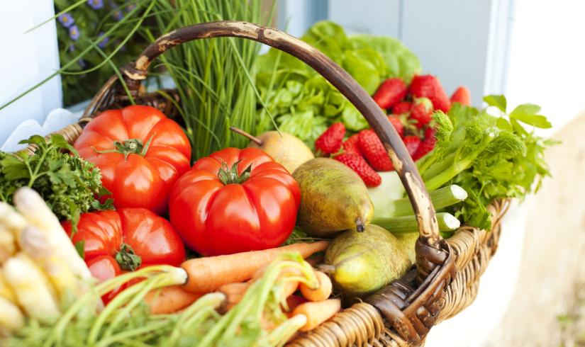 A basket of bright, healthy foods.