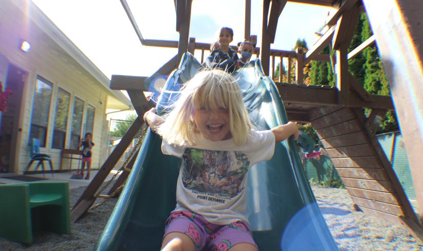 Children in the full-time preschool playing on the playground at the UP ELC