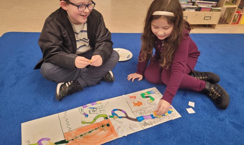 Creating their board games at winter camp!