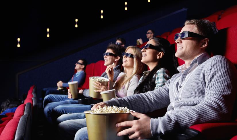 photo of a group of people watching a movie