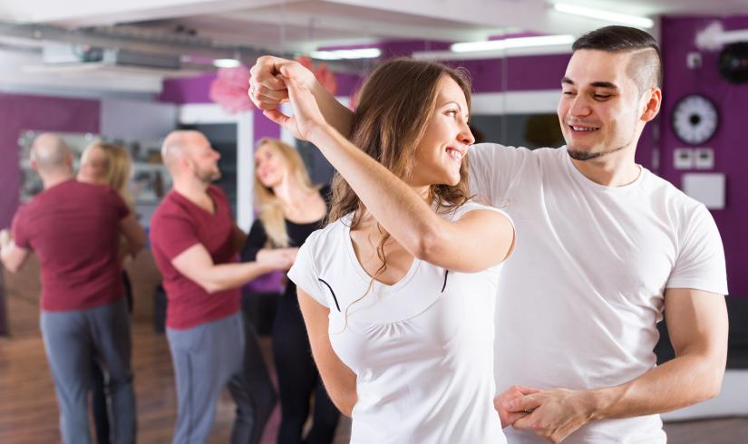 Dance partners in the middle of a spin move