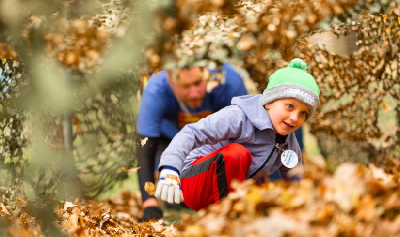 Child Playing in Leaves