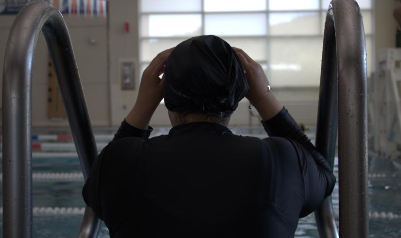Shot of a swimmer adjusting their swim cap before starting some laps at the YMCA