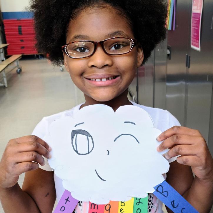 Girl Showing Off Art in YMCA Visual Arts Class