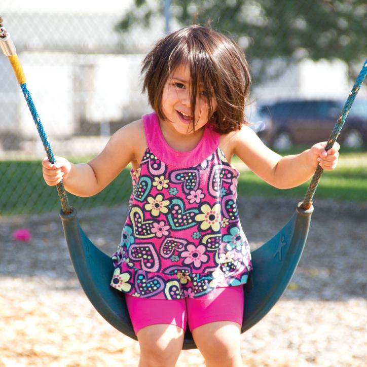Smiling and Swinging At YMCA Child Care