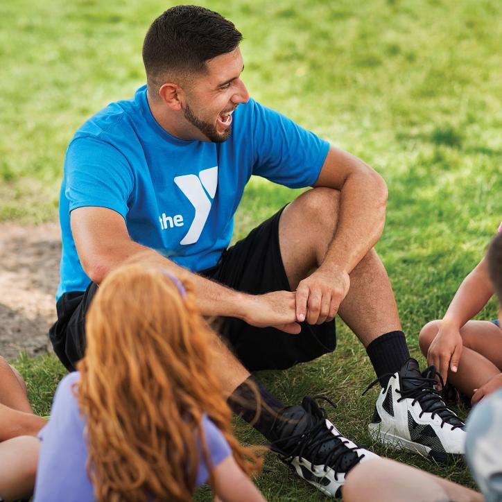 YMCA Summer Camp Volunteer Talking with Kids
