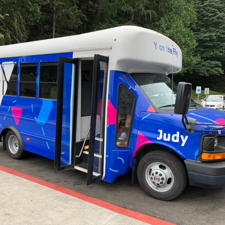 A bus with the name Judy on the side is parked in Tacoma, Washington.
