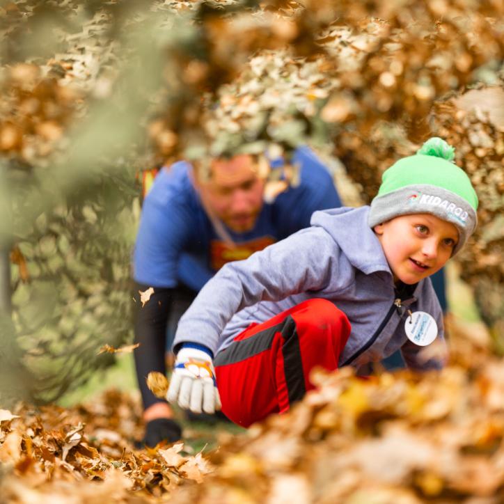 Child Playing in Leaves