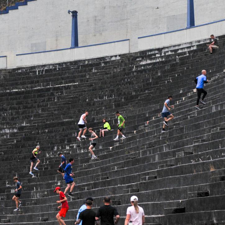 Unleashed participants run the steps at the Stadium High School football field
