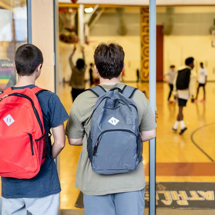 Late nite students enter the doorway of the main gym at the YMCA