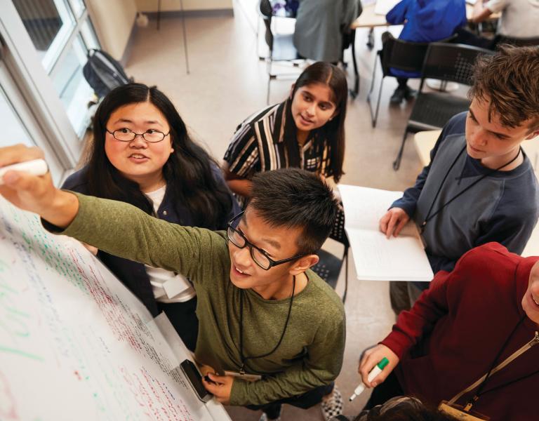 Teenagers working together on a project