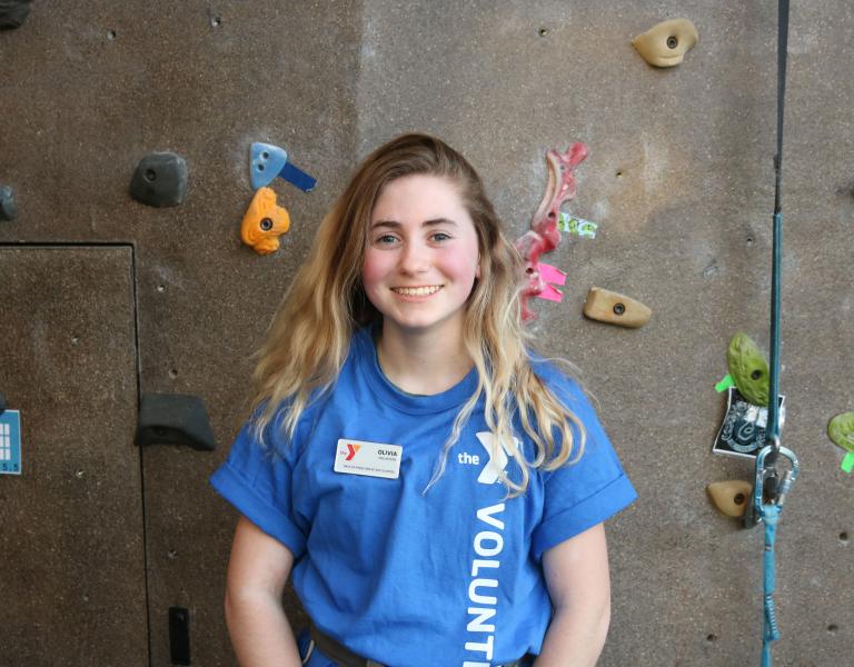 YMCA Volunteer At A Rock Wall In A YMCA of Pierce and Kitsap Counties Facility