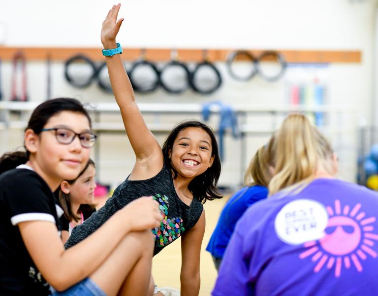 Kids having fun at YMCA summer camp indoors