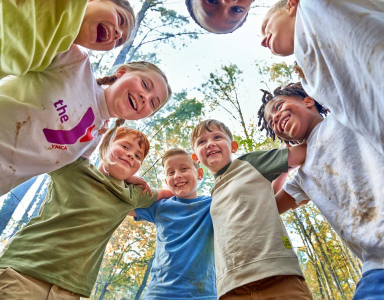 YMCA Camp Kids Having Fun Huddling In Circle