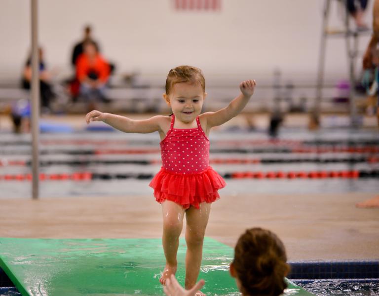 Toddler Jumping In The Pool At YMCA Swim Lessons