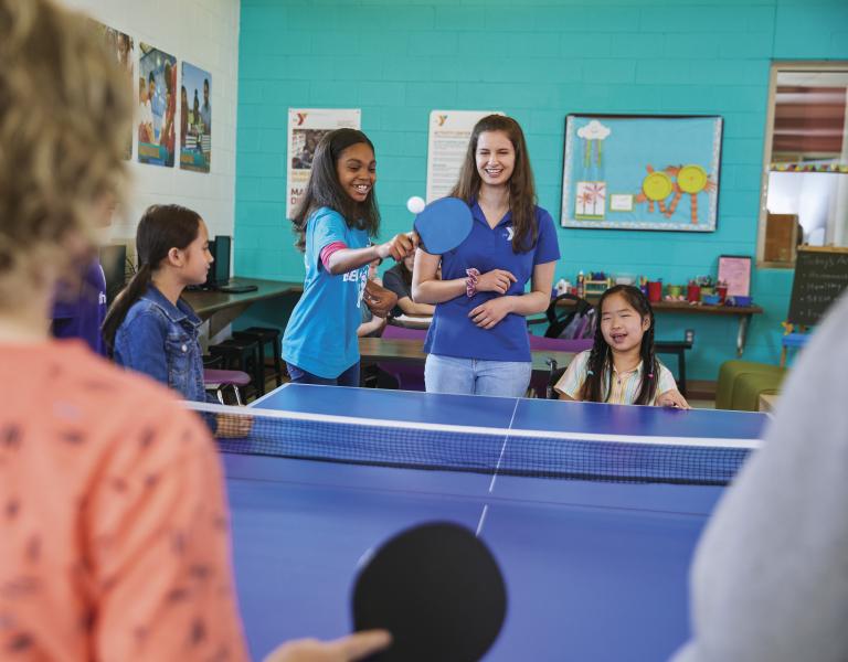 Youth enjoying game of table tennis