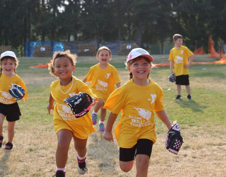 Tball skills youth running with mits in hand