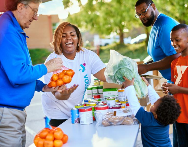 Giving Out Produce at YMCA Community Event