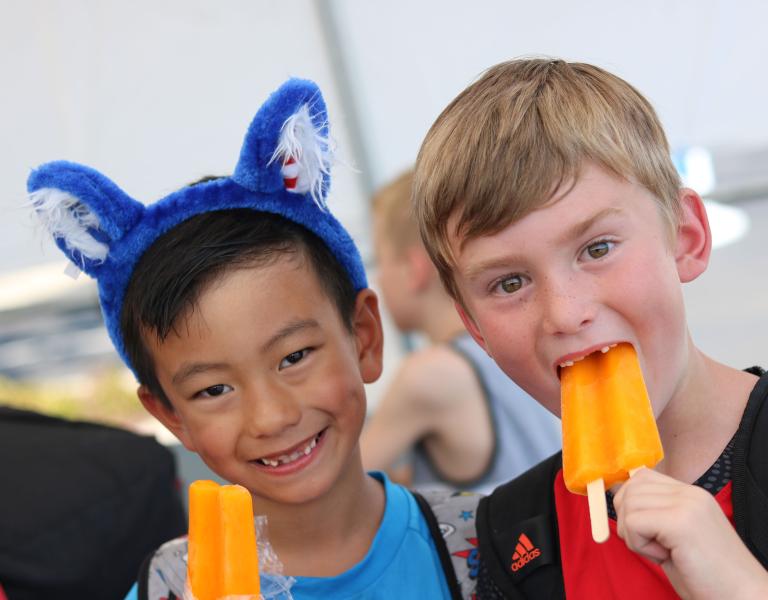 Friends Eating Popsicles at YMCA Healthy Kids Day