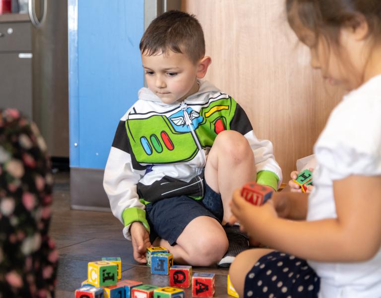 Child care youth playing with blocks