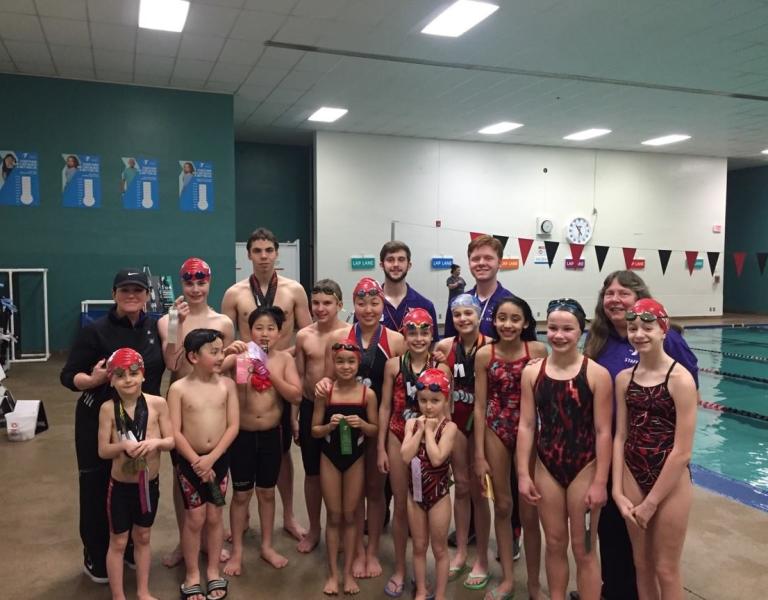 Team photo of the Morgan Sea Dragons at the YMCA pool