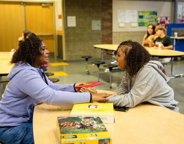 Late Nite Teens play board games at Late Nite at their local school