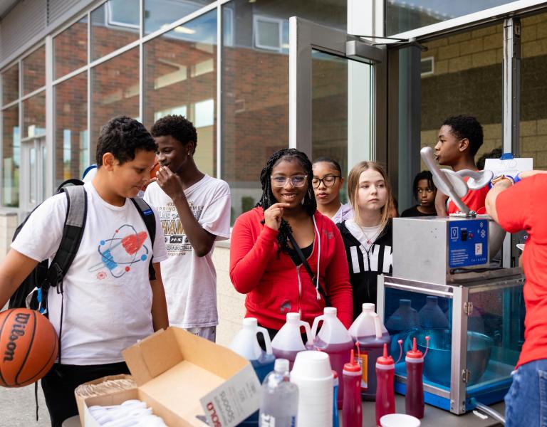 Late nite participants queue up for snow cones at the YMCA