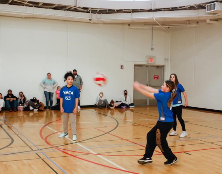 Action shot of volleyball player bumping the ball at the YMCA
