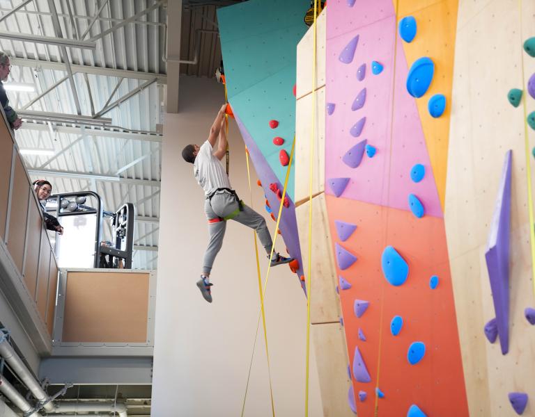 Climbing Up Pearl Street Rock Wall