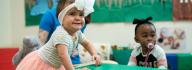 Infants With Bows in Hair at YMCA Early Learning Center