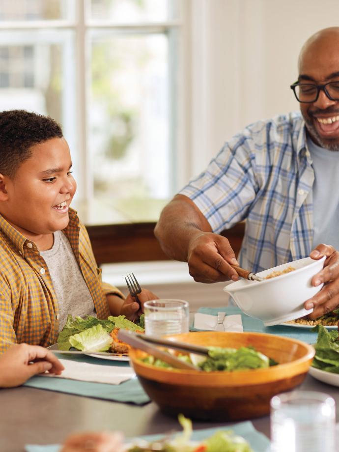 YMCA Healthy Living Eating Salad With Family