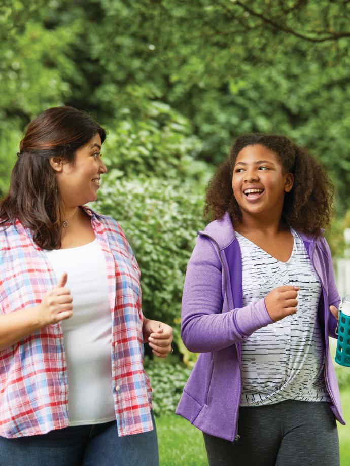 Mother and Daughter Walking Together With YMCA Weight Loss Program