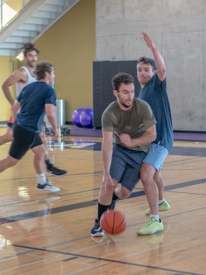 Group Playing Basketball At Their Local YMCA