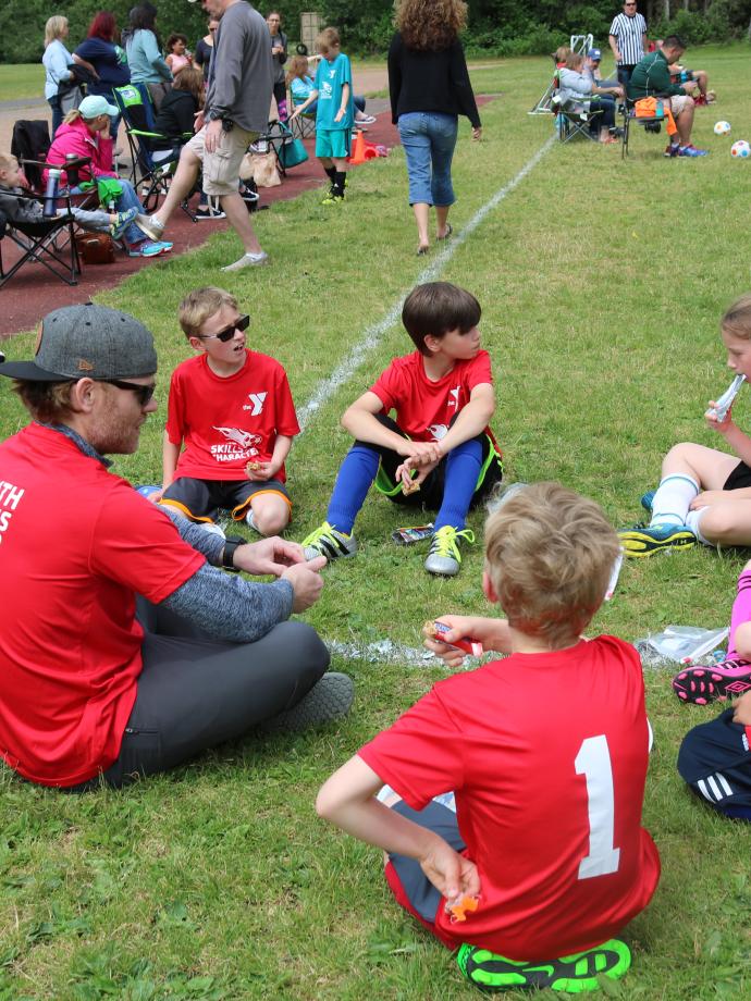 Youth soccer team in a team huddle