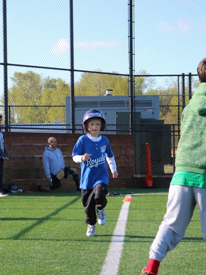 T-ball participant running to first base