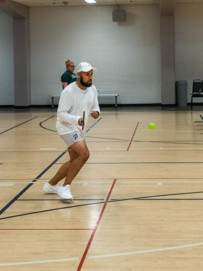 Man lining up for a pickleball shot