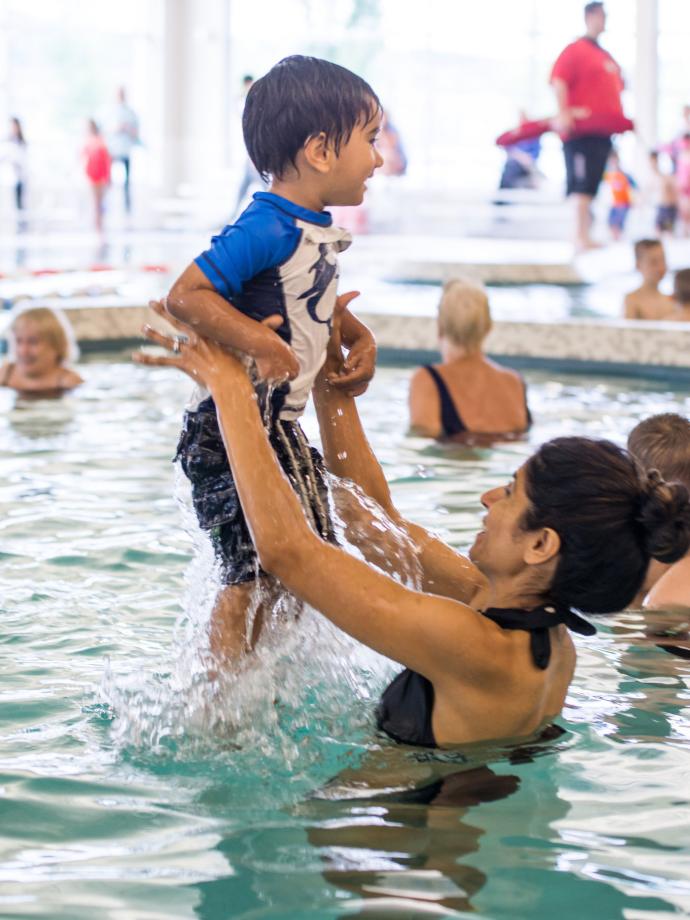 Mother and Child Playing During Open Swim at the YMCA