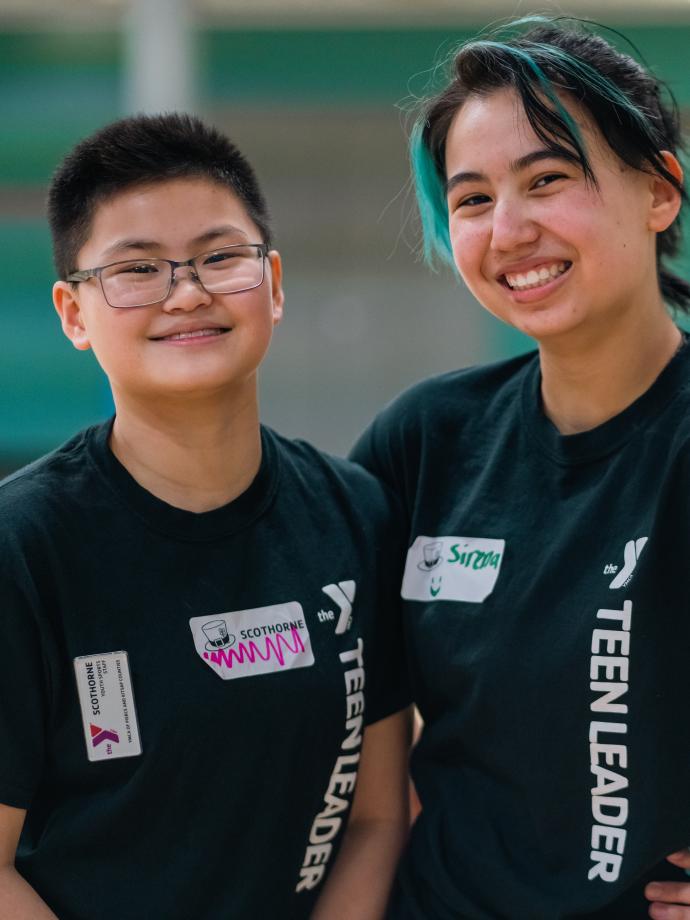 Teen Leaders pose in the gym of a YMCA