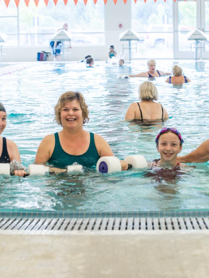 4 Generations of a family pose for a picture after a water aerobics session