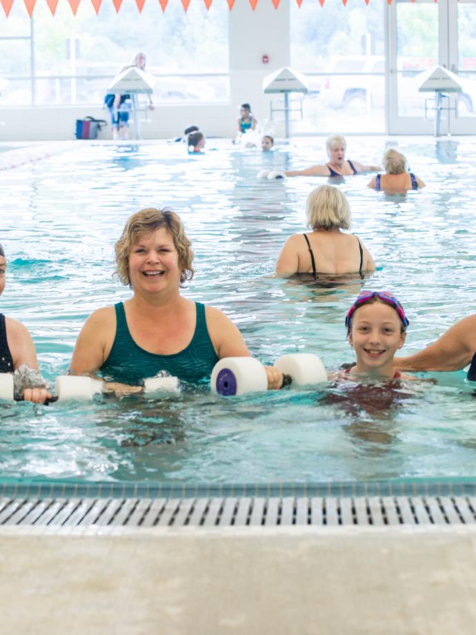 4 Generations of a family pose for a picture after a water aerobics session