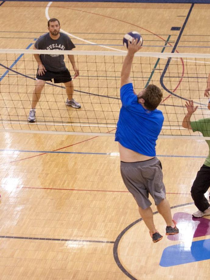 Action shot of a great spike by a volleyball player at the YMCA