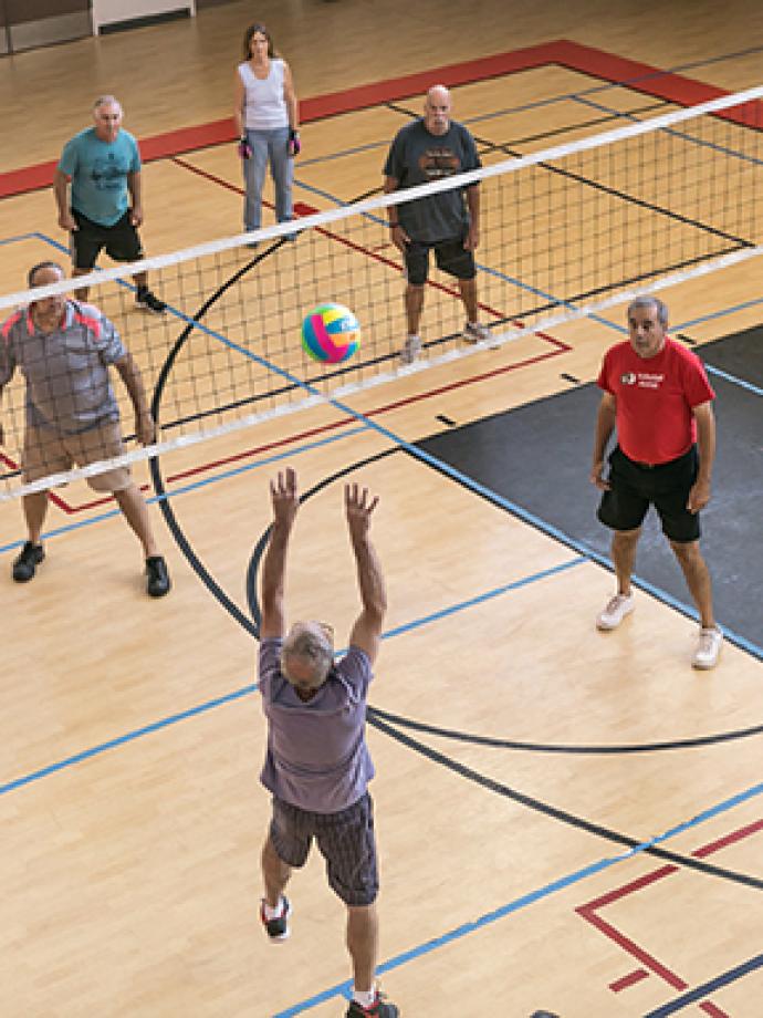 Action shot of a good set by an offensive volleyball player at the YMCA