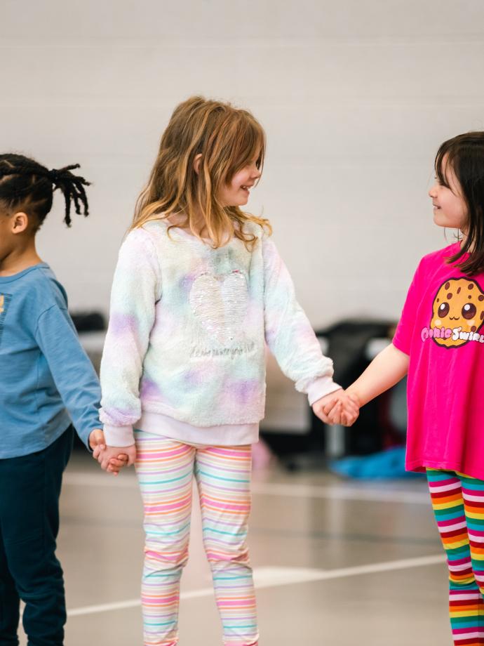 Peninsula School District Winter Break Camp Young Girls Holding Hands