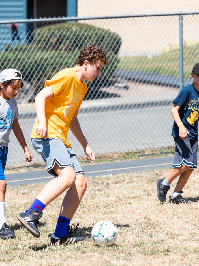 CIT plays soccer with campers at the YMCA