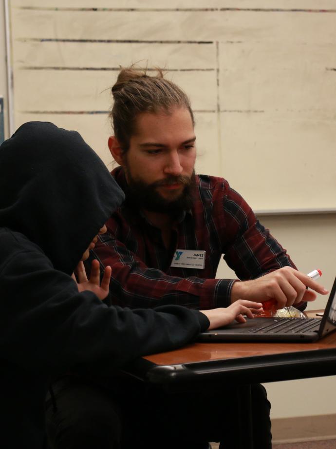 CLC Student receives help with homework during study time at the YMCA